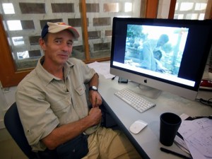 Filmmaker and digital historian Max Stahl with an image from his 1991 Santa Cruz massacre footage in Timor-Leste. Photo: David Robie