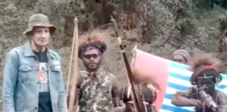 NZ pilot Phillip Merhtens with some of his West Papuan rebel captors