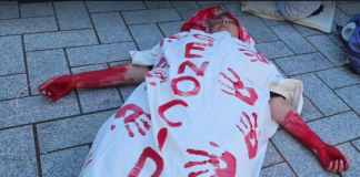 One of the about 20 mock bodies in the Gaza "die-in" at Te Komititanga Square on Sunday