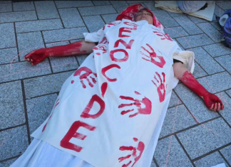 One of the about 20 mock bodies in the Gaza "die-in" at Te Komititanga Square on Sunday