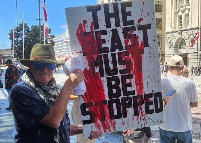 Protester Craig Tynan holds up his “The beast must be stopped” placard at yesterday’s pro-Palestinian rally