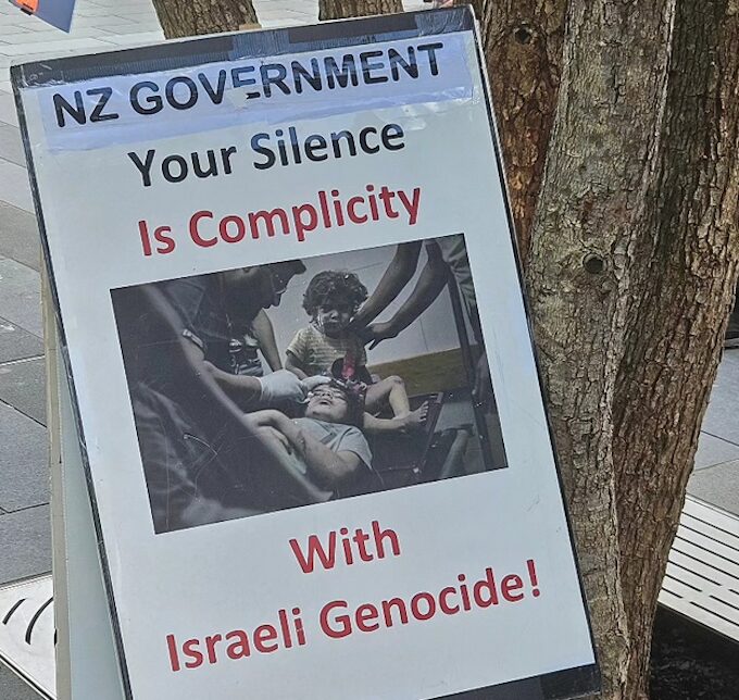 A “NZ government – your silence is complicity with Israeli genocide” placard at yesterday’s protest