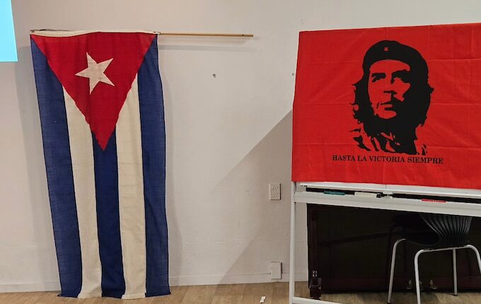 The Cuban flag and an iconic image of Ernesto “Che” Guevara