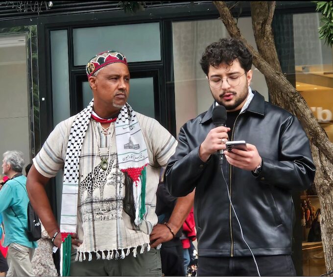 Ali Reza (right) with MC Achmat Esau speaking in Te Komititanga Square today