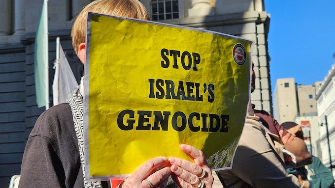 A "Stop Israel's genocide" poster