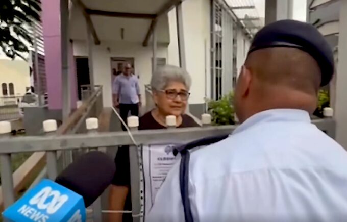Fiji police talk to a Palestine protest organiser, Fiji Women's Crisis Centre coordinator Shamima Ali
